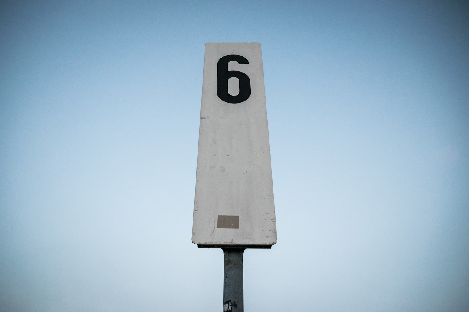 white and black p printed road sign