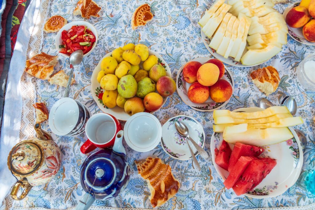 a table topped with lots of different types of fruit