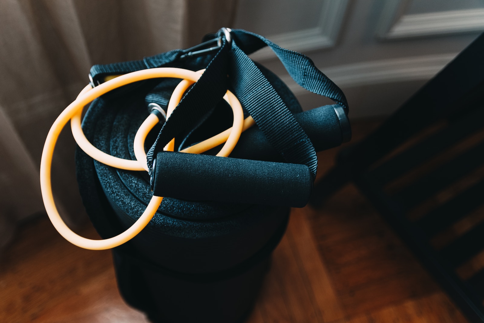 shallow focus photography of yellow and black stretch rope